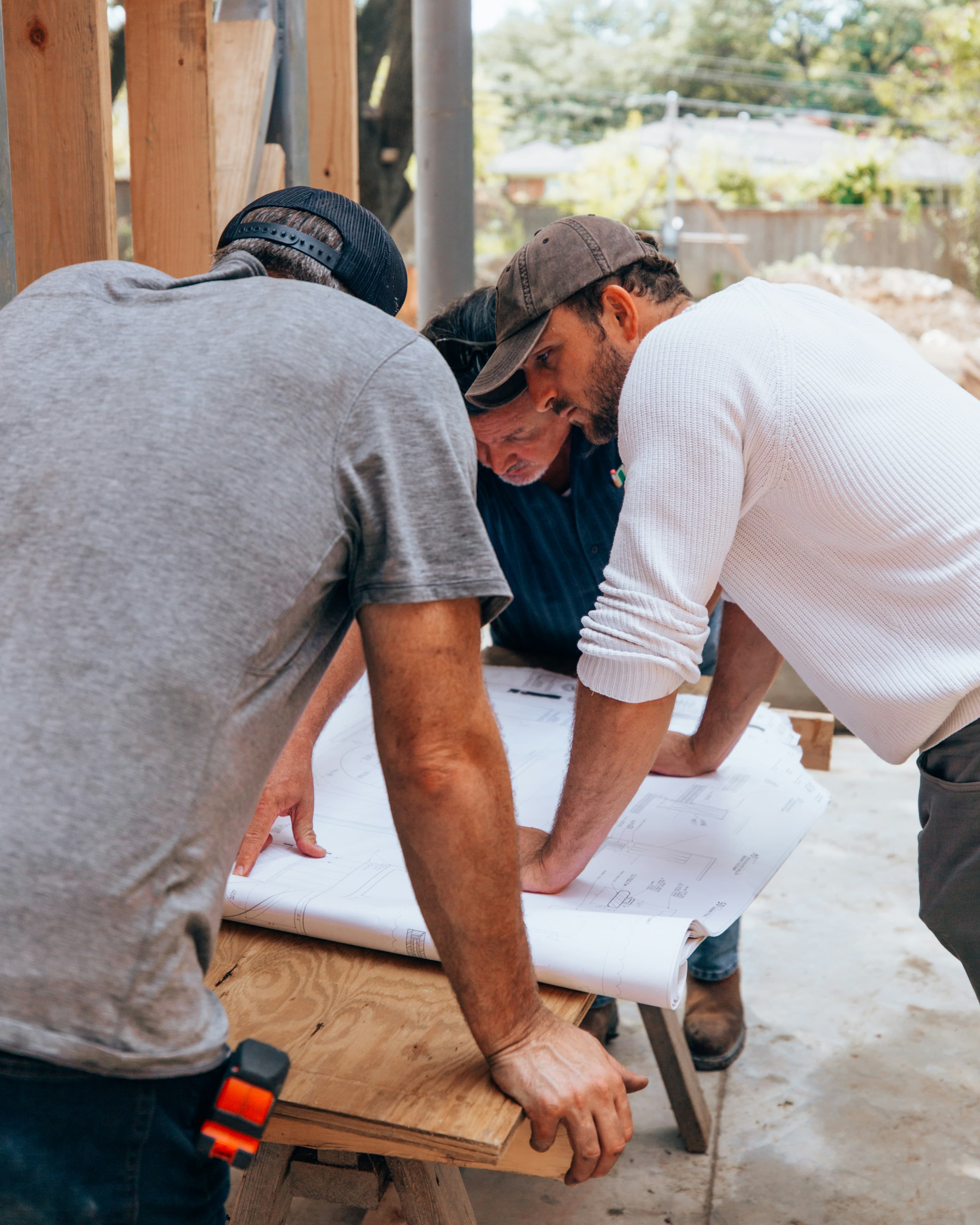 Construction professionals reviewing project plans